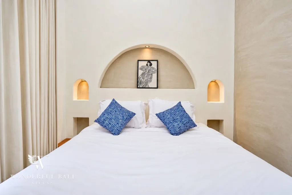 2BR villa for sale in Sanur — double bed with arched headboard and reading niches