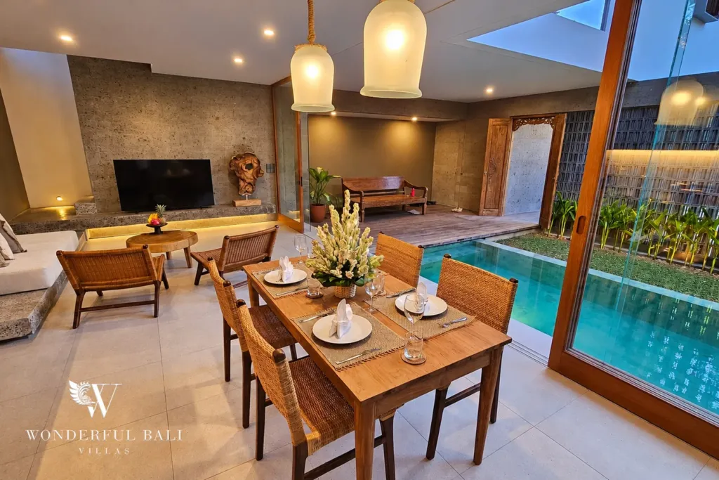 2BR villa long term rental Pererenan — dining table beside the pool