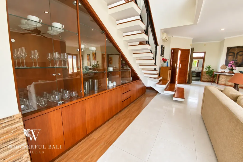 3BR villa for rent in Sanur — glass display cabinet under the staircase
