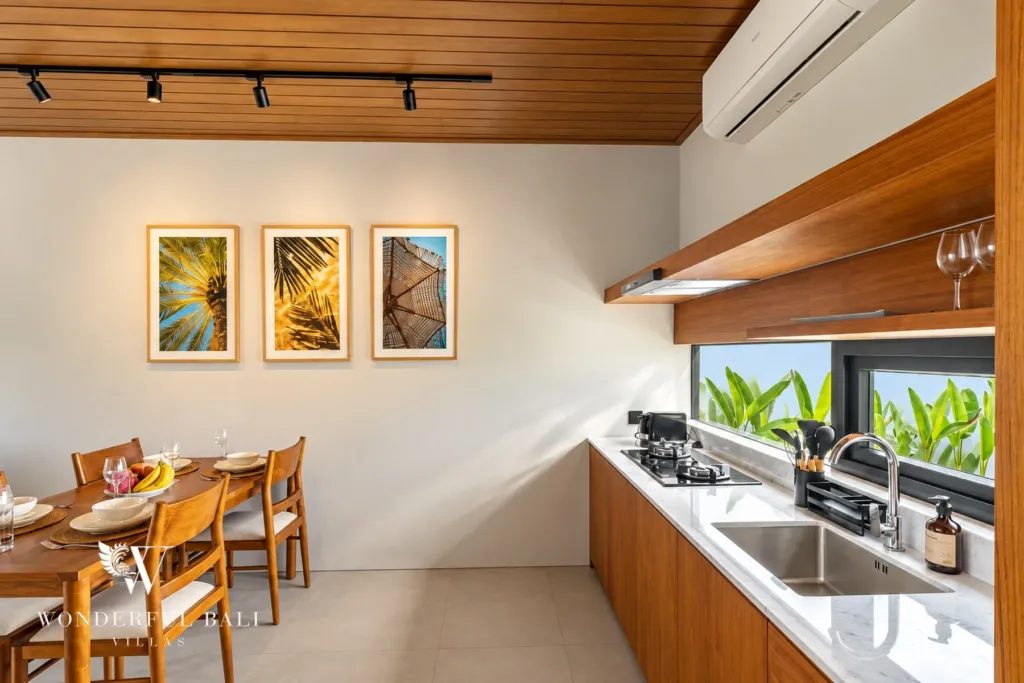 3BR villa long term rental Canggu — kitchen with garden window and dining table