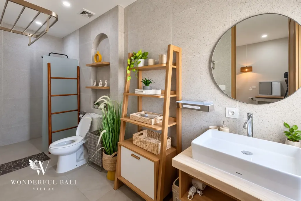 2BR villa for sale in Sanur — bathroom with round mirror and vessel basin