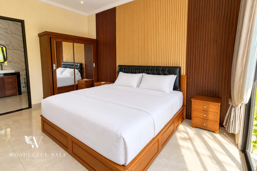 3BR villa for sale or rent in Sanur — bedroom with wardrobe and timber headboard wall
