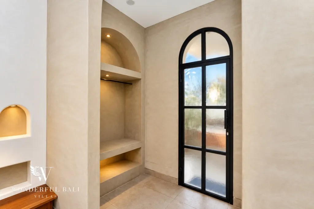 2BR villa for sale in Sanur — open wardrobe niches and arched glass door