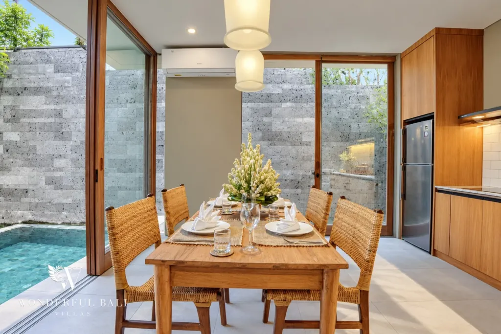 2BR villa long term rental Pererenan — dining table with pool view