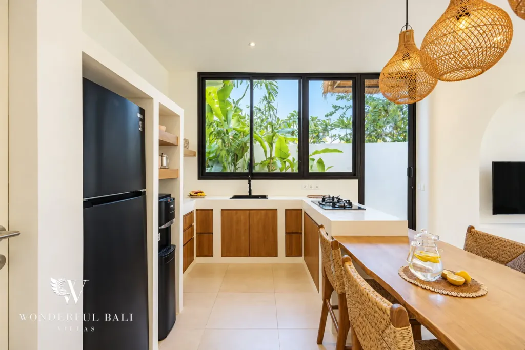 2BR villa for rent in Munggu — kitchen with fridge, gas hob and garden window