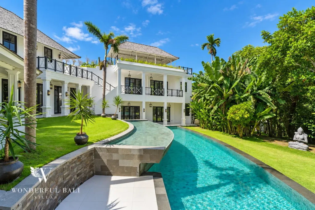 7BR villa for sale in Umalas — long pool running through the tropical garden