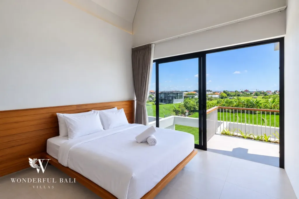 3BR villa long term rental Canggu — bedroom with sliding doors to the balcony