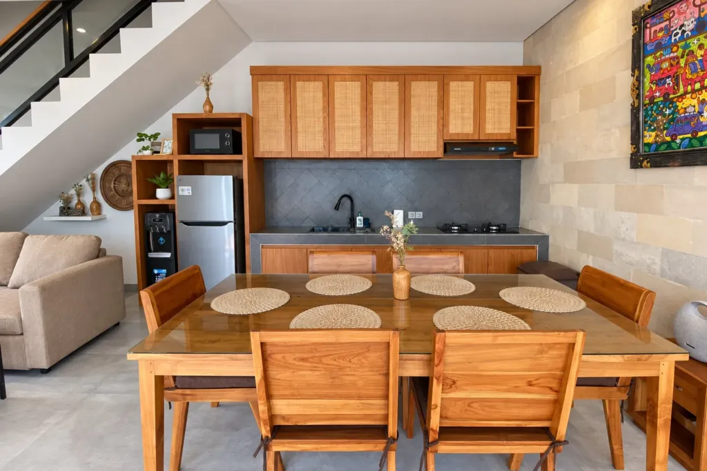 3BR villa for rent in Sanur — teak kitchen with dining table for six