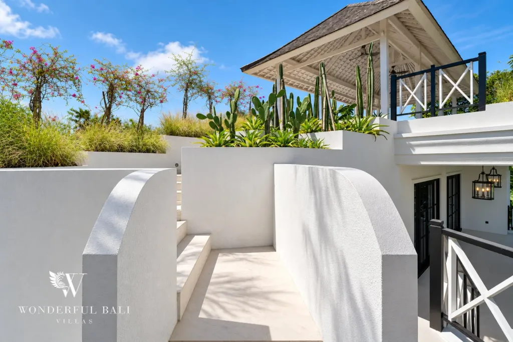 7BR villa for sale in Umalas — white rooftop terrace with steps up to the lounge pavilion