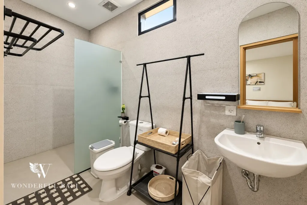 2BR villa for sale in Sanur — second bathroom with arched mirror and shower