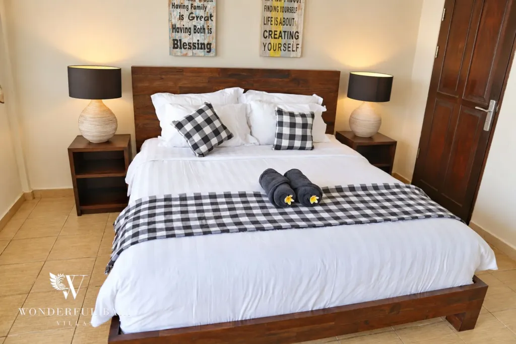 3BR villa for rent in Tabanan — bedroom with king bed and timber headboard