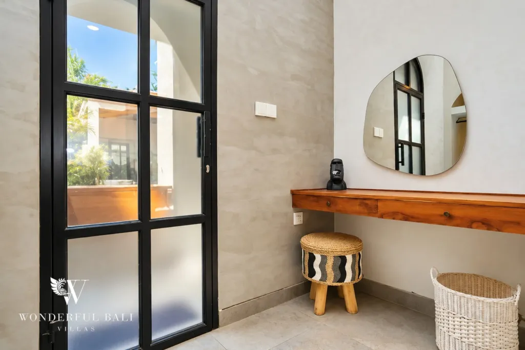 2BR villa for sale in Sanur — dressing table beside a frosted glass door