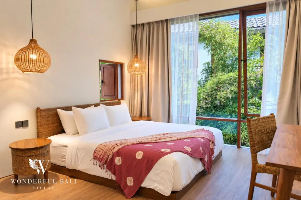 2BR villa long term rental Pererenan — bedroom with tall garden windows