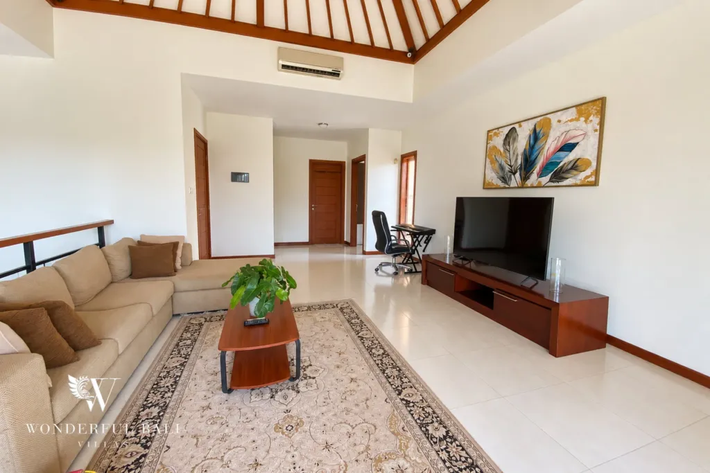 3BR villa for rent in Sanur — upstairs lounge with corner sofa and TV