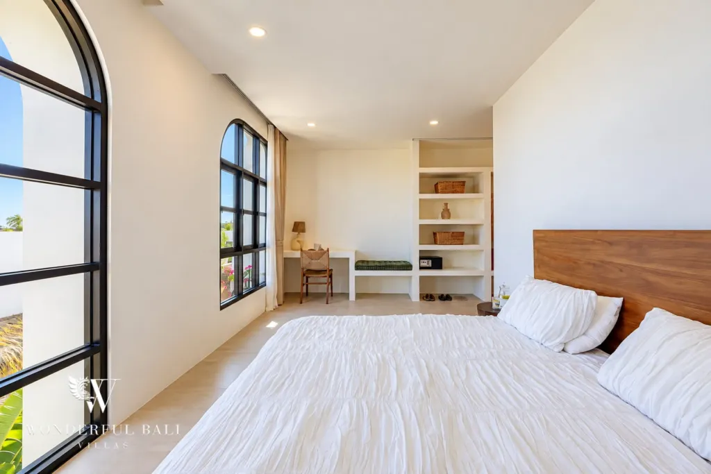 2BR villa for rent in Munggu — bedroom with tall arched windows