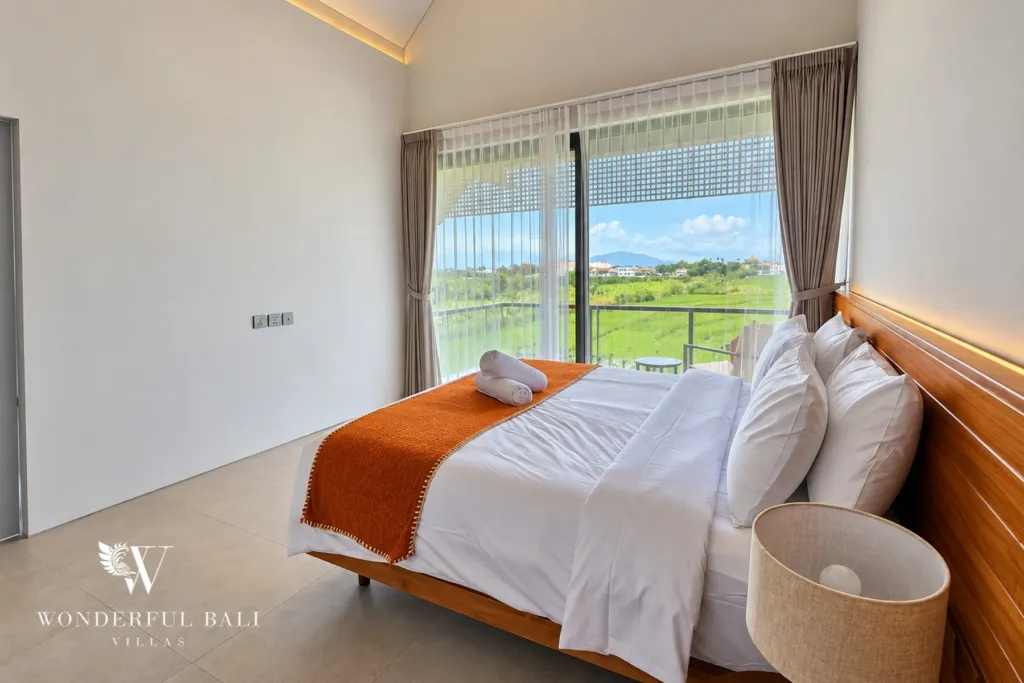 3BR villa long term rental Canggu — bedroom with floor-to-ceiling window