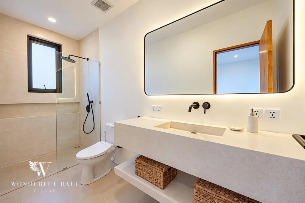 2BR villa for rent in Munggu — bathroom with rain shower and backlit mirror