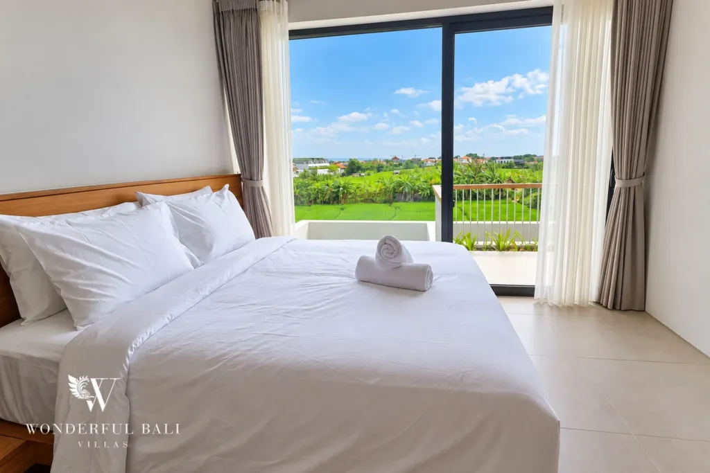 3BR villa long term rental Canggu — bedroom with rice field view