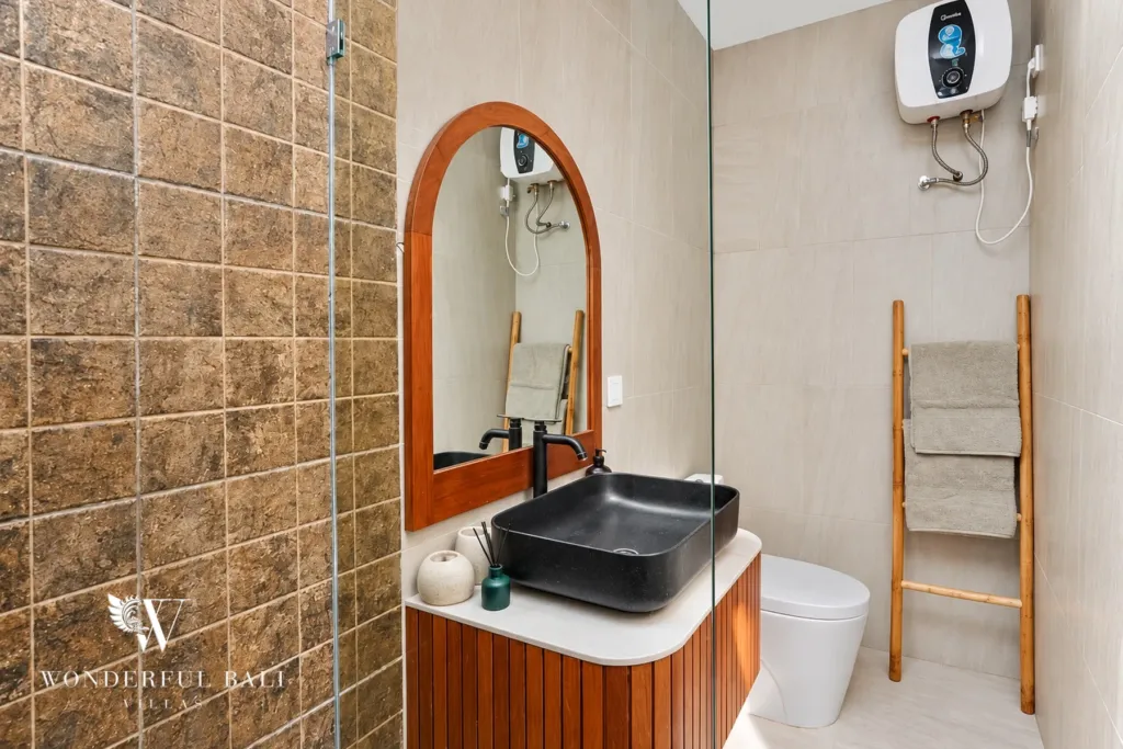 2BR villa for sale in Sanur — ensuite with arched mirror and black basin