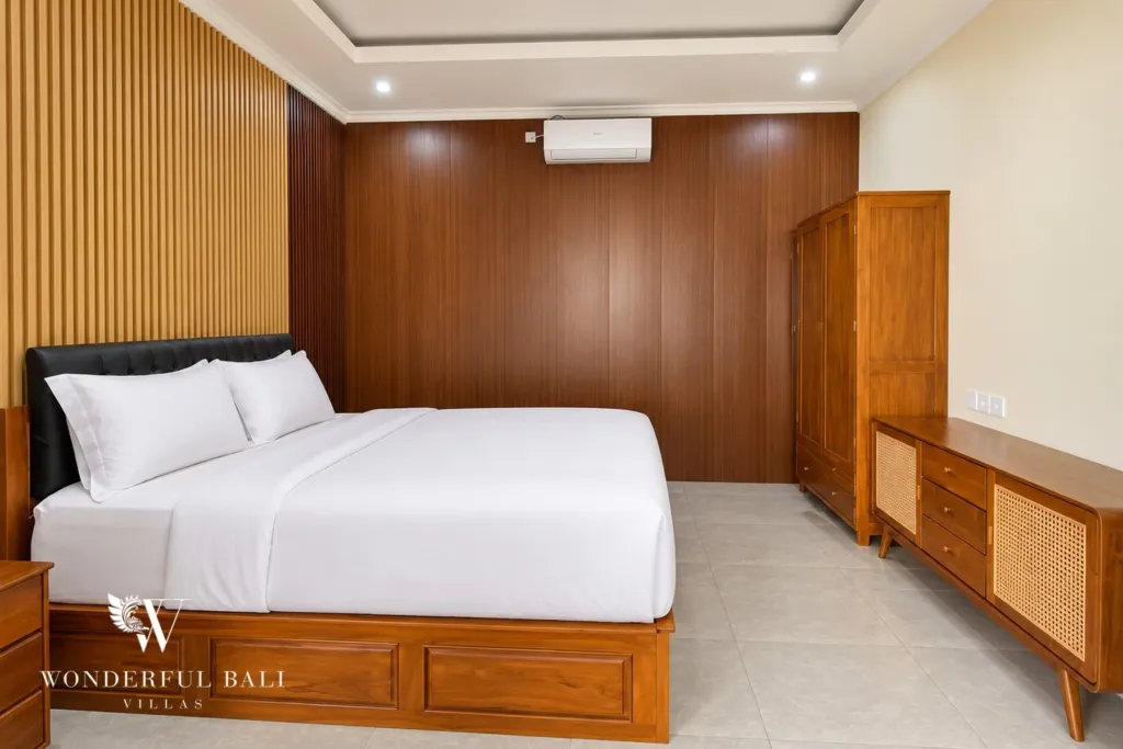 3BR villa for sale or rent in Sanur — third bedroom with wardrobe and timber headboard wall