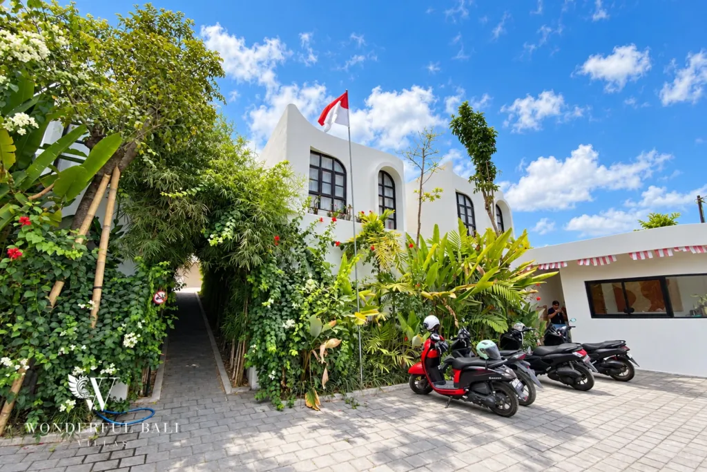 2BR villa for rent in Munggu — green entrance path and scooter parking