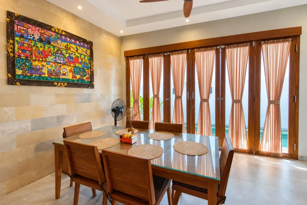 3BR villa for rent in Sanur — dining table for six beside the pool doors