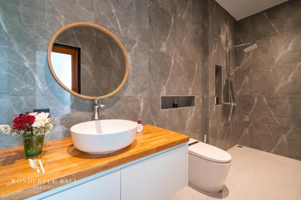 3BR villa for sale in Saba, Gianyar — marble-look bathroom with round mirror and vessel basin