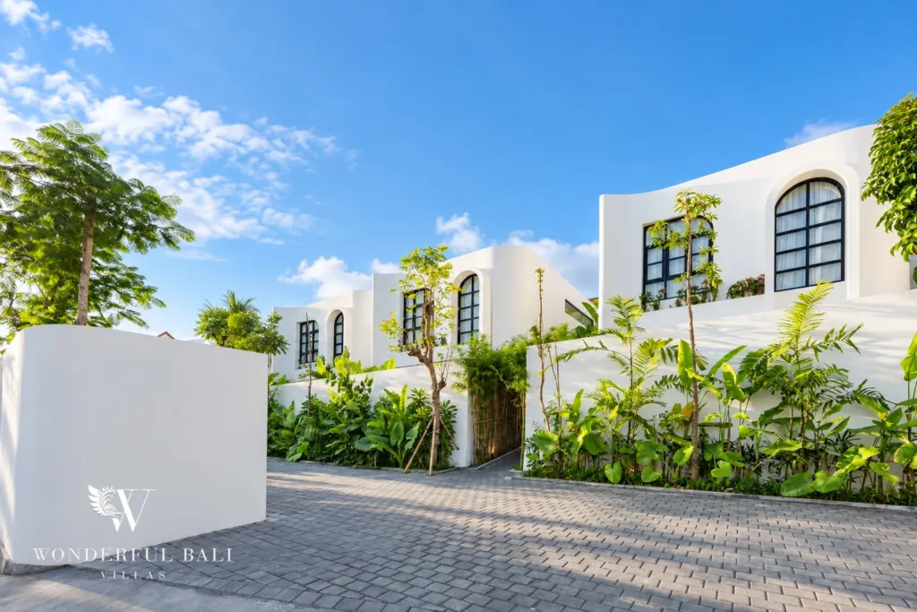 2BR villa for rent in Munggu — white villas with arched windows among palms
