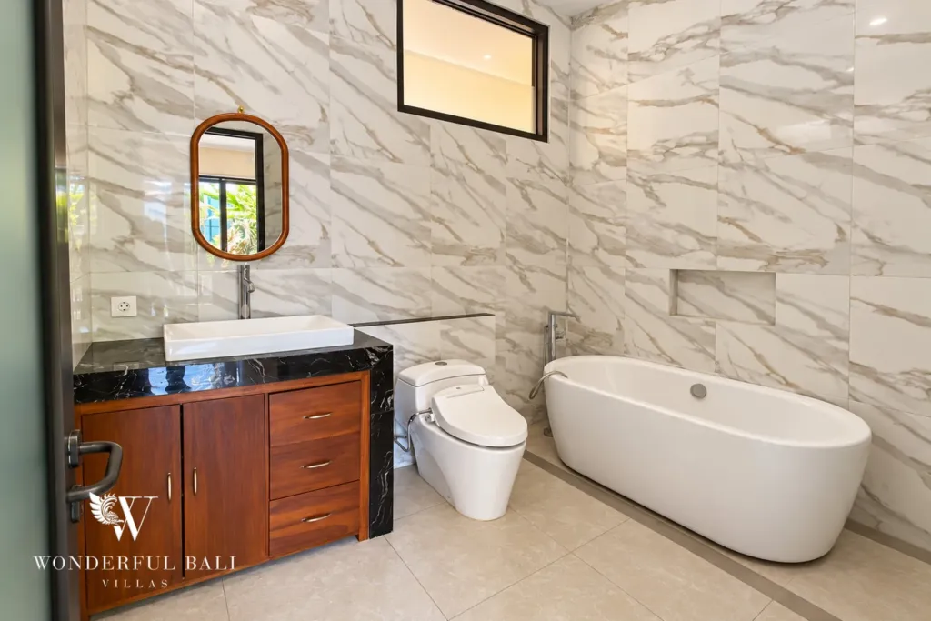 3BR villa for sale or rent in Sanur — marble-look bathroom with freestanding bathtub