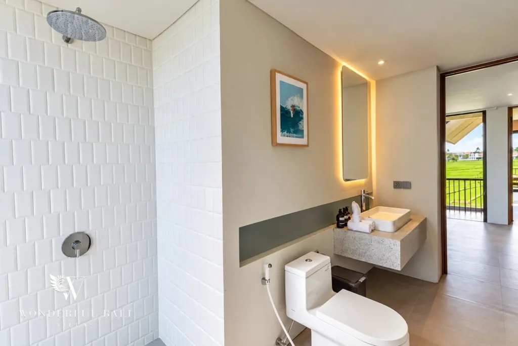 3BR villa long term rental Canggu — bathroom with rain shower and backlit mirror