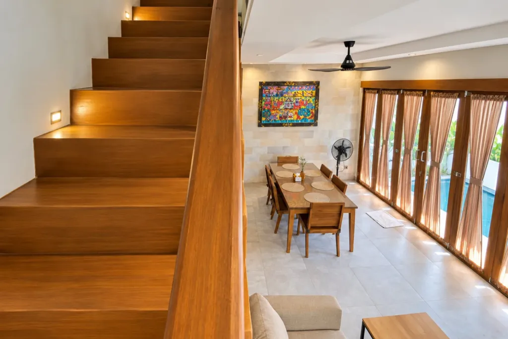 3BR villa for rent in Sanur — teak staircase down to the dining and living area