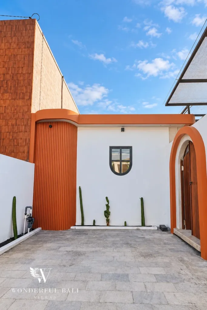 2BR villa for sale in Sanur — villa entrance with arched timber door