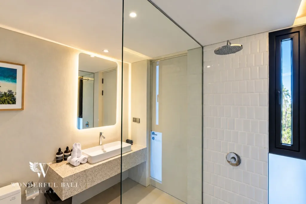 3BR villa long term rental Canggu — bathroom with glass-screen rain shower