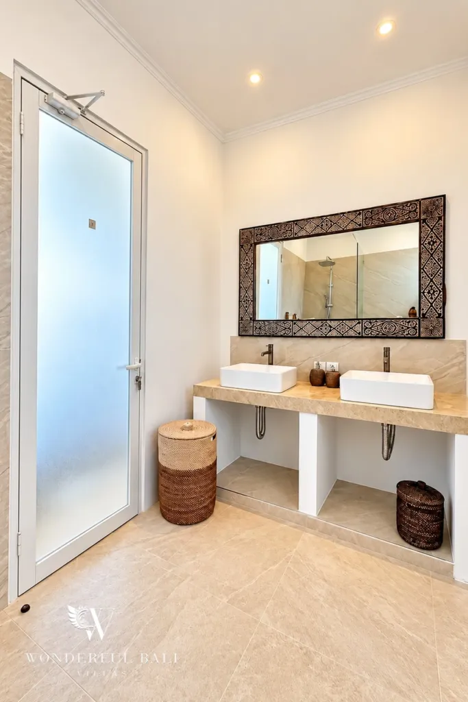 3BR villa for rent in Padonan — double vanity with carved timber mirror