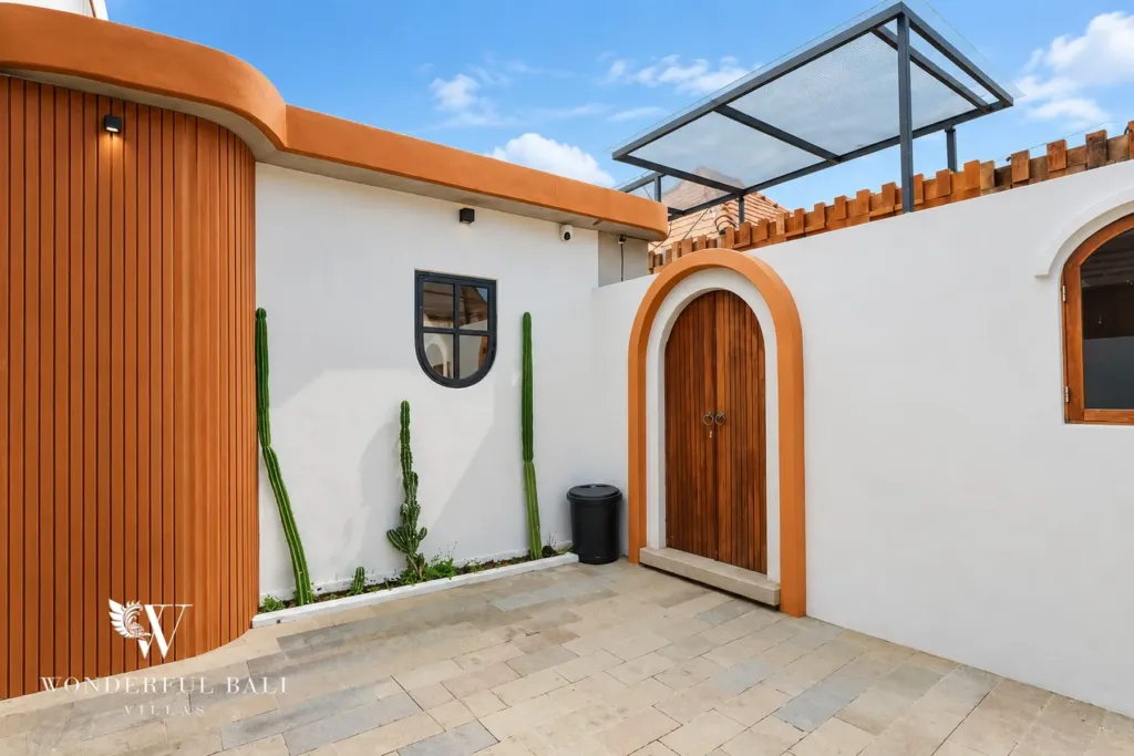 2BR villa for sale in Sanur — front courtyard with arched timber door