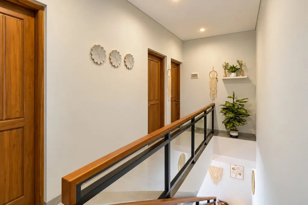 3BR villa for rent in Sanur — bright upstairs hallway with glass balustrade