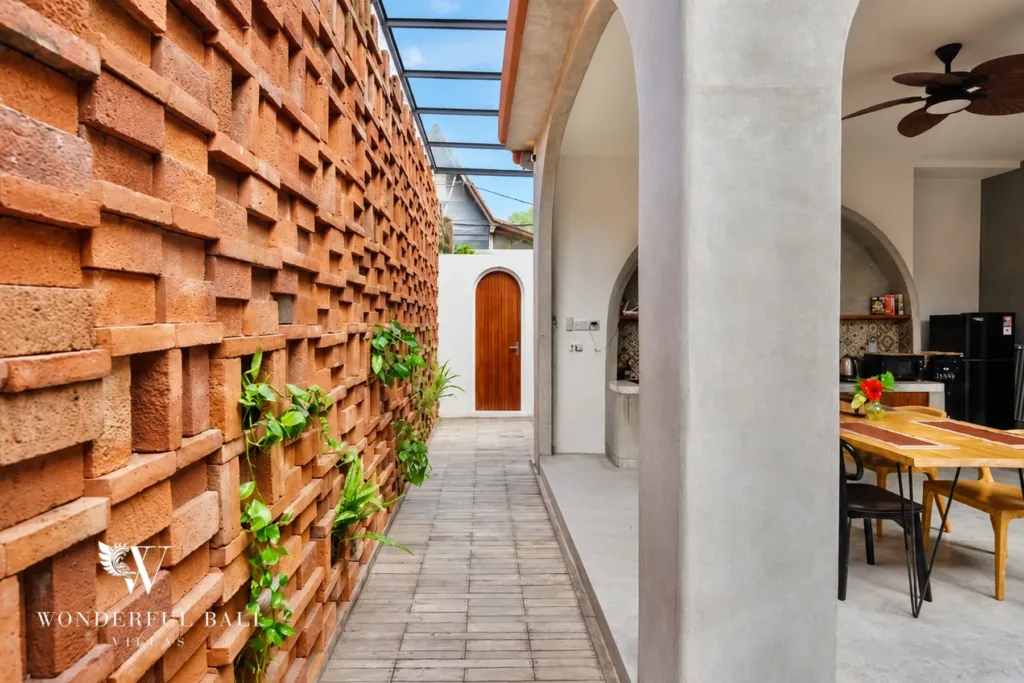 2BR villa for sale in Sanur — walkway along the terracotta breeze-block wall