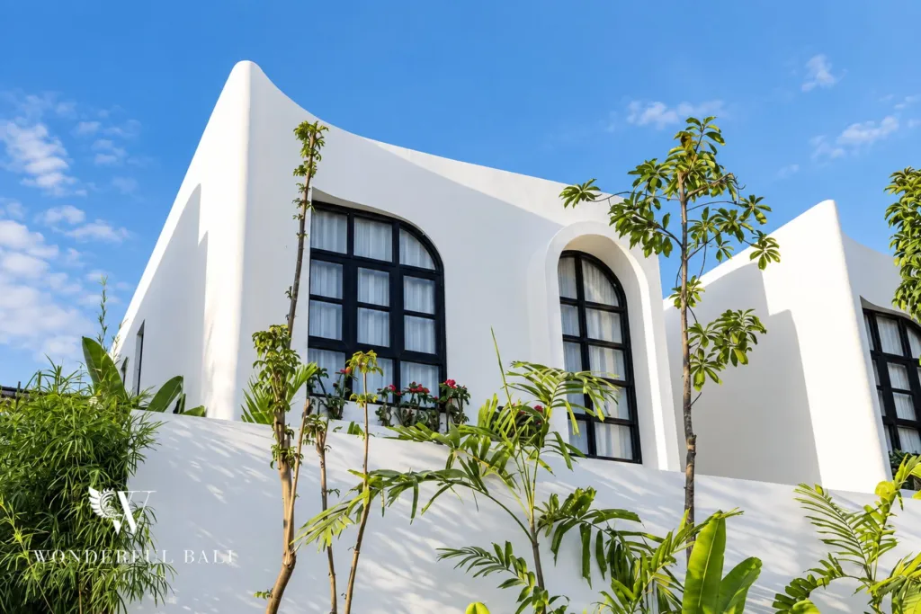 2BR villa for rent in Munggu — curved white facade with arched windows