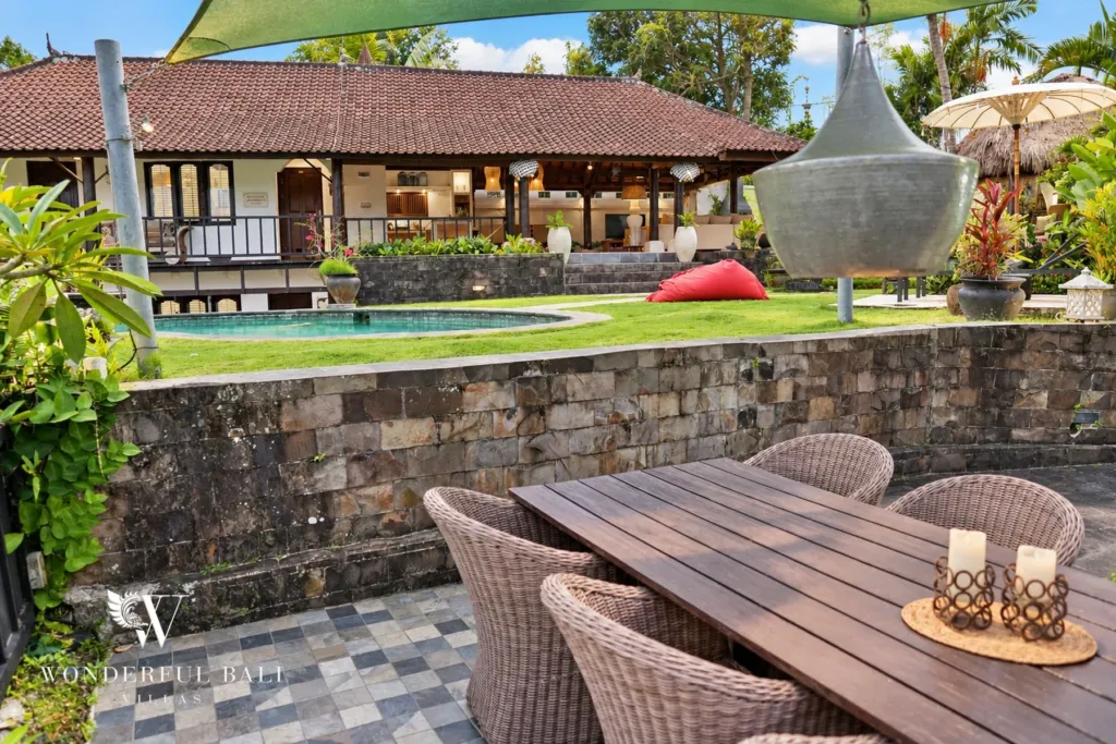 3BR villa for rent in Tabanan — outdoor dining terrace with the villa and pool behind