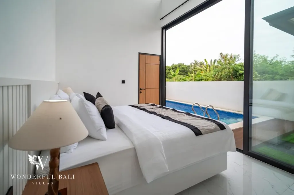 3BR villa for sale in Saba, Gianyar — bedroom with glass door to the pool