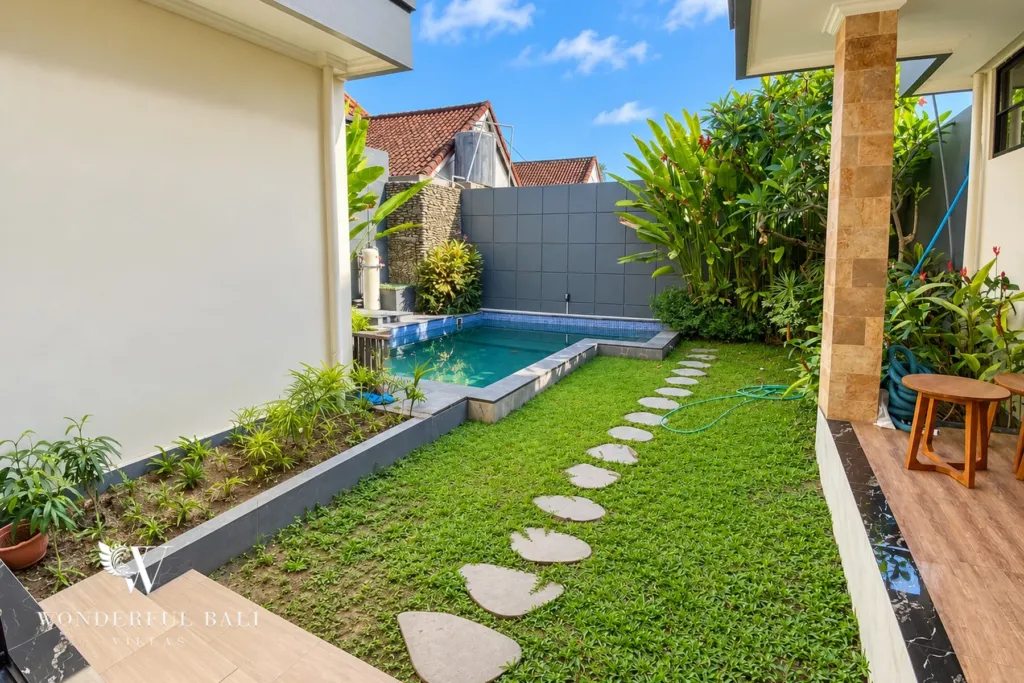 3BR villa for sale or rent in Sanur — garden path with stepping stones along the pool