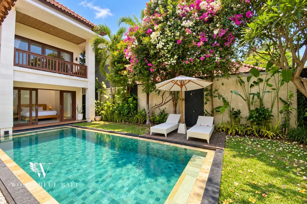 3BR villa Berawa, Canggu — poolside loungers under bougainvillea