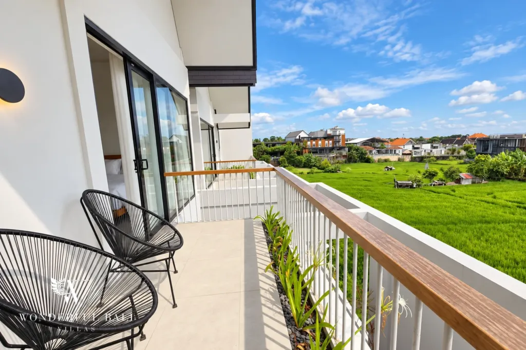 3BR villa long term rental Canggu — balcony with chairs above the rice fields