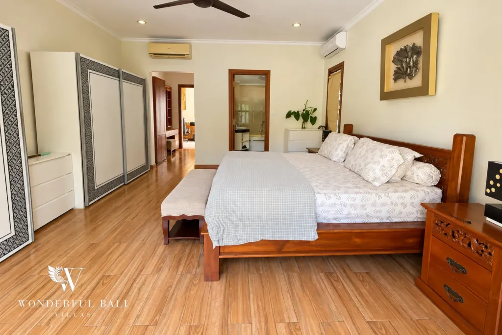 3BR villa for rent in Sanur — bedroom with timber floor and wardrobes