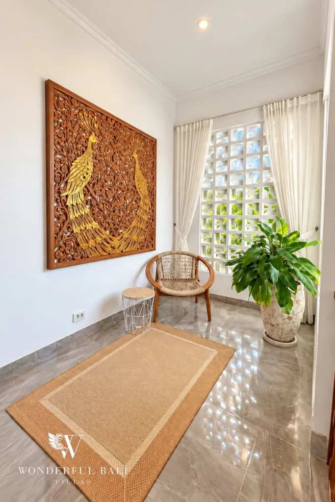 3BR villa for rent in Padonan — upstairs sitting nook with carved peacock panel