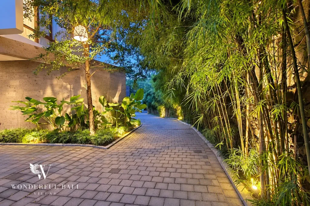 2BR villa long term rental Pererenan — bamboo-lined entrance path at dusk
