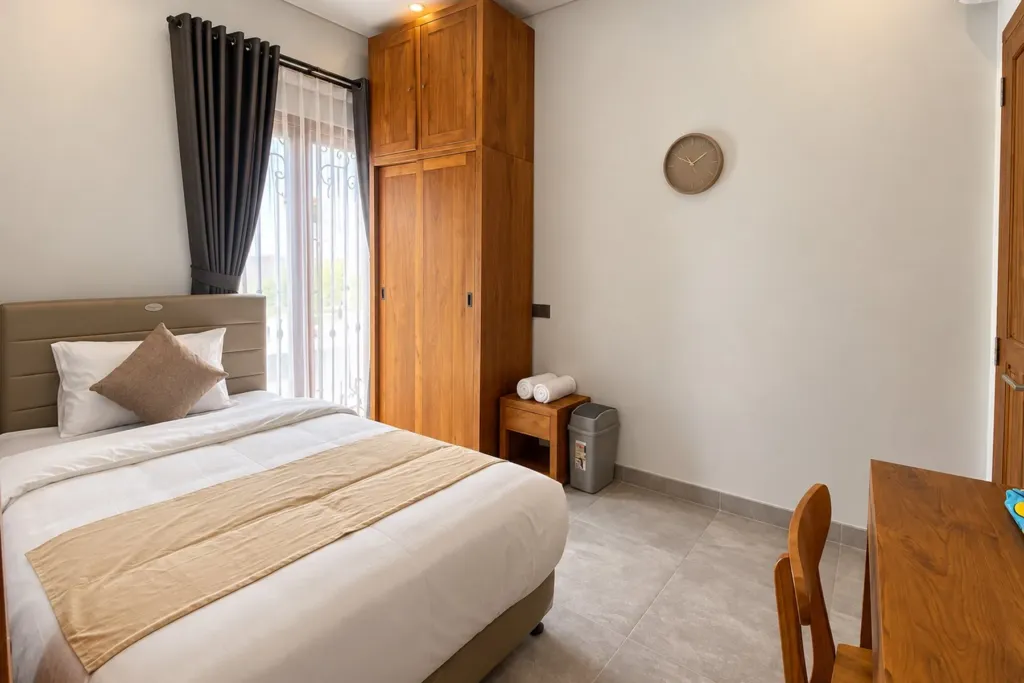 3BR villa for rent in Sanur — second bedroom with teak wardrobe and desk