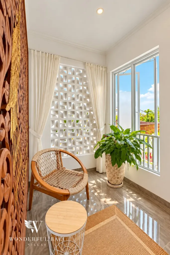 3BR villa for rent in Padonan — reading chair by a breeze-block window