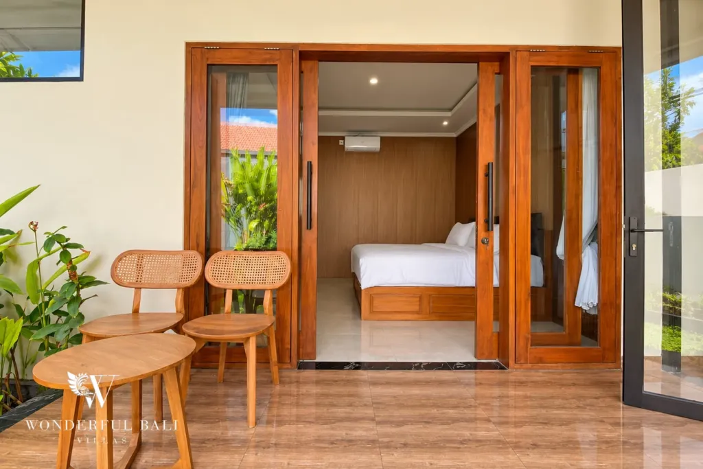 3BR villa for sale or rent in Sanur — bedroom terrace with two chairs and a side table