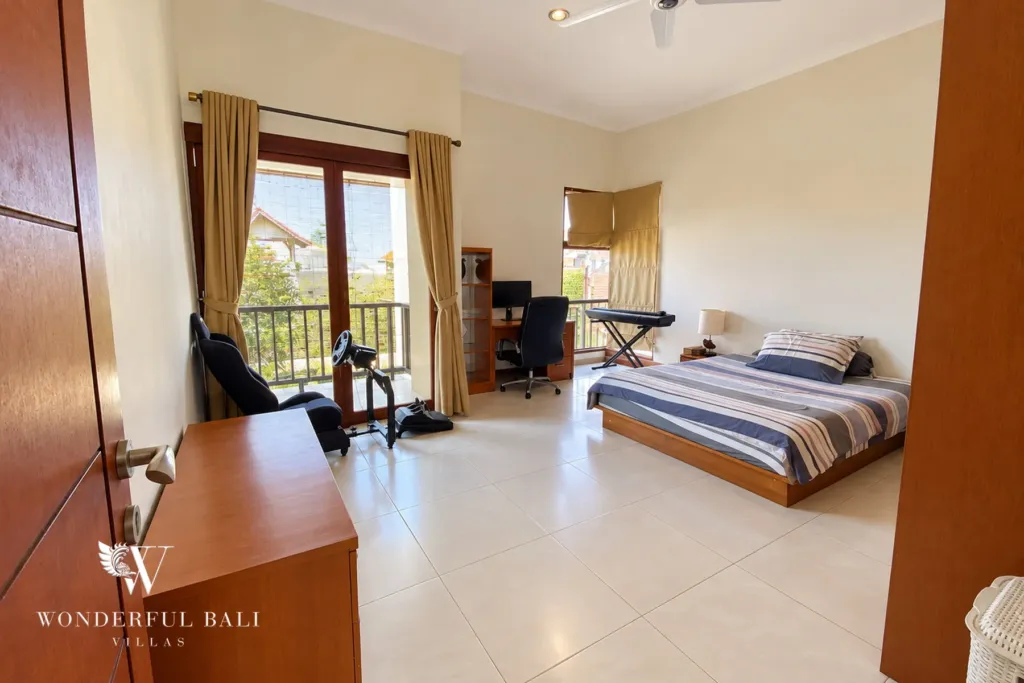 3BR villa for rent in Sanur — bedroom with balcony and workspace